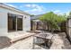 An inviting backyard with a fire pit, patio, and sliding glass door to the home at 103 Gleason Cv, Sanford, FL 32773