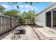 A peaceful backyard with a fire pit and view of the home's exterior, offering a serene retreat at 103 Gleason Cv, Sanford, FL 32773
