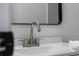 Close-up of a modern bathroom faucet on a white sink at 103 Gleason Cv, Sanford, FL 32773