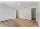 This bedroom has wood floors, and a large closet, offering ample storage and a clean design at 103 Gleason Cv, Sanford, FL 32773