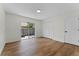 Bedroom featuring wood-look flooring and a sliding door to a small patio area at 103 Gleason Cv, Sanford, FL 32773