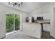 Open kitchen layout with a view to backyard through sliding glass doors at 103 Gleason Cv, Sanford, FL 32773