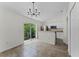 Bright kitchen and dining area lead to a private, green backyard at 103 Gleason Cv, Sanford, FL 32773