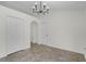 Spacious living room with modern light fixture and neutral color palette at 103 Gleason Cv, Sanford, FL 32773