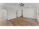 The living room features laminate floors, a ceiling fan, and access to kitchen at 103 Gleason Cv, Sanford, FL 32773