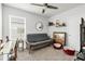 Versatile bedroom is set up as a cozy retreat with dog beds, sofa, and a convenient desk at 115 Duchess Rd, Deland, FL 32724