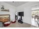 Bedroom with a TV, adjacent to what looks like an eat in kitchen area, offering a relaxed and connected living space at 115 Duchess Rd, Deland, FL 32724