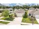 Beautiful single-story home featuring a manicured lawn, charming landscaping, and a two-car garage at 115 Duchess Rd, Deland, FL 32724