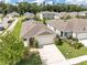 Charming single-story home with manicured lawn, two-car garage, and inviting curb appeal in a Gathering-friendly neighborhood at 115 Duchess Rd, Deland, FL 32724