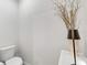Modern half bathroom includes a stylish lamp with white ceramic base, and a unique decorative plant at 115 Duchess Rd, Deland, FL 32724