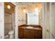 Bathroom with sink vanity and unique wallpaper at 1171 Covewood Trl, Maitland, FL 32751