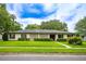 Charming single-story home featuring well-maintained landscaping and a welcoming facade on a sunny day at 1171 Covewood Trl, Maitland, FL 32751
