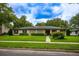 Charming single-story home featuring well-maintained landscaping and a welcoming facade on a sunny day at 1171 Covewood Trl, Maitland, FL 32751
