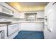 Functional kitchen with white appliances, ample cabinet space, and a bright, airy feel at 1171 Covewood Trl, Maitland, FL 32751