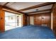 Cozy room with wooden paneling, sliding doors, and carpet floor at 1171 Covewood Trl, Maitland, FL 32751