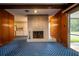 Spacious living room with brick fireplace and access to the outdoor patio at 1171 Covewood Trl, Maitland, FL 32751