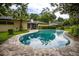Backyard view showcasing the inviting pool, screened in porch, and the home's exterior at 1171 Covewood Trl, Maitland, FL 32751