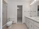 A clean bathroom with a double sink vanity and a glass shower at 137 Hickory Ridge Cir, Lake Mary, FL 32746