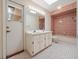 Bathroom boasts double sinks, ample vanity storage, a shower-tub combo, and backyard access at 137 Hickory Ridge Cir, Lake Mary, FL 32746