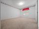A bright bedroom with neutral carpet and patterned wallpaper at 137 Hickory Ridge Cir, Lake Mary, FL 32746