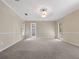 Spacious bedroom with neutral carpet, paint and natural light at 137 Hickory Ridge Cir, Lake Mary, FL 32746