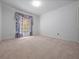Empty bedroom featuring plush carpeting, ample natural light, and neutral walls at 137 Hickory Ridge Cir, Lake Mary, FL 32746