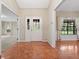 Foyer featuring beautiful parquet flooring, a white front door with sidelights and a view into other rooms at 137 Hickory Ridge Cir, Lake Mary, FL 32746