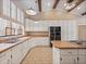 Well-lit kitchen with a window over the sink, wood countertops and tiled floors at 137 Hickory Ridge Cir, Lake Mary, FL 32746