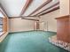 A spacious living room with exposed beams, a fireplace, and french doors at 137 Hickory Ridge Cir, Lake Mary, FL 32746