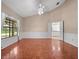 The expansive living room boasts elegant parquet floors and natural light through a large window at 137 Hickory Ridge Cir, Lake Mary, FL 32746