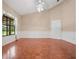 The expansive living room boasts elegant parquet floors and natural light through a large window at 137 Hickory Ridge Cir, Lake Mary, FL 32746