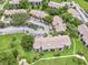 Community aerial view showcases lush landscaping, a large parking lot, and well-maintained residential buildings at 14 Escondido Ct # 134, Altamonte Springs, FL 32701