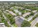Extensive aerial view of a condo community showcasing beautiful landscaping, a serene lake, and well-maintained residential buildings at 14 Escondido Ct # 134, Altamonte Springs, FL 32701