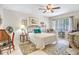 Bright bedroom with a ceiling fan, neutral color scheme, and two plush area rugs at 14 Escondido Ct # 134, Altamonte Springs, FL 32701