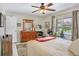 Comfortable bedroom with ample natural light, ceiling fan, and stylish decor at 14 Escondido Ct # 134, Altamonte Springs, FL 32701