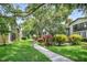 Sidewalk path, community pond with mature trees and shrubs at 14 Escondido Ct # 134, Altamonte Springs, FL 32701