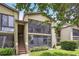 Apartment featuring balcony, lush landscaping, and inviting facade at 14 Escondido Ct # 134, Altamonte Springs, FL 32701