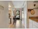 The tiled hallway features a coat closet, utility closet, and view of the doorway to the exterior at 14 Escondido Ct # 134, Altamonte Springs, FL 32701