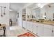 The view shows a galley-style kitchen with butcher block counters, white cabinets, and tiled flooring at 14 Escondido Ct # 134, Altamonte Springs, FL 32701