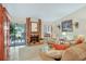 Comfortable living room with a brick fireplace and sliding glass doors that open to a balcony at 14 Escondido Ct # 134, Altamonte Springs, FL 32701