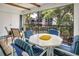 Inviting patio with comfortable seating and a view of the lush, landscaped grounds at 14 Escondido Ct # 134, Altamonte Springs, FL 32701