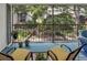 Relaxing screened patio with a scenic view of landscaped grounds and a tranquil water feature at 14 Escondido Ct # 134, Altamonte Springs, FL 32701