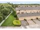 Aerial view of homes, manicured lawn, driveways and garage parking at 14474 Prunningwood Pl, Winter Garden, FL 34787