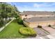 Aerial view showcases townhomes, landscaping, lawn and parking spaces at 14474 Prunningwood Pl, Winter Garden, FL 34787