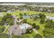 Aerial view of community amenities including pool, tennis courts, playground, and green space at 14474 Prunningwood Pl, Winter Garden, FL 34787