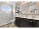 Bright bathroom with double sinks, a glass shower and decorative accents at 14474 Prunningwood Pl, Winter Garden, FL 34787