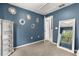 A blue bedroom featuring an open closet and decorative accents at 14474 Prunningwood Pl, Winter Garden, FL 34787