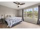 Inviting bedroom featuring large windows offering an outdoor view at 14474 Prunningwood Pl, Winter Garden, FL 34787