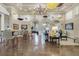 Spacious clubhouse lounge area with decorative umbrellas hanging from the ceiling and lots of natural light at 14474 Prunningwood Pl, Winter Garden, FL 34787