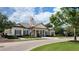 Attractive community building with classic architectural details and manicured landscaping at 14474 Prunningwood Pl, Winter Garden, FL 34787
